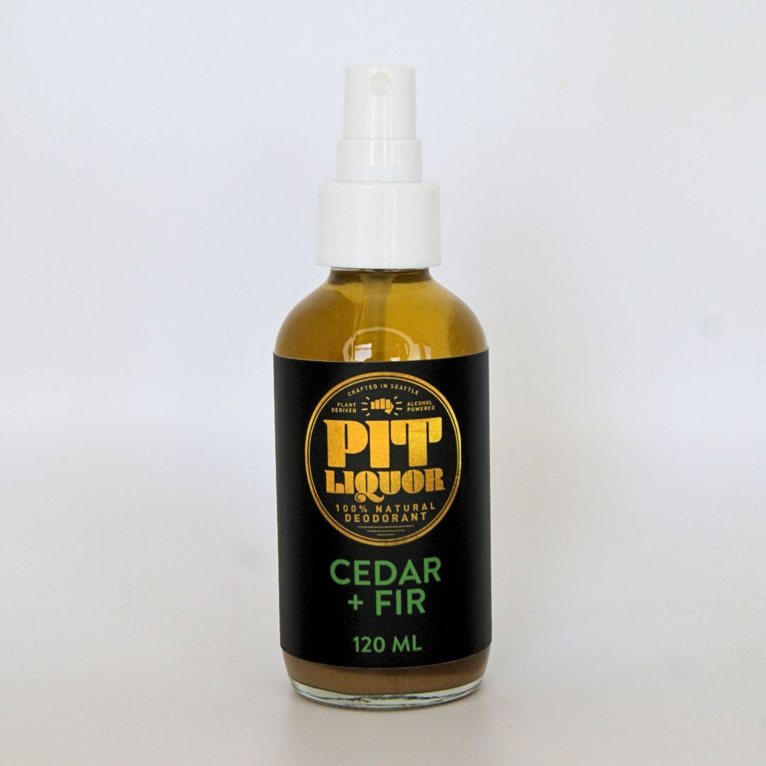 Bottle of Pit Liquor Cedar + Fir deodorant on a white background