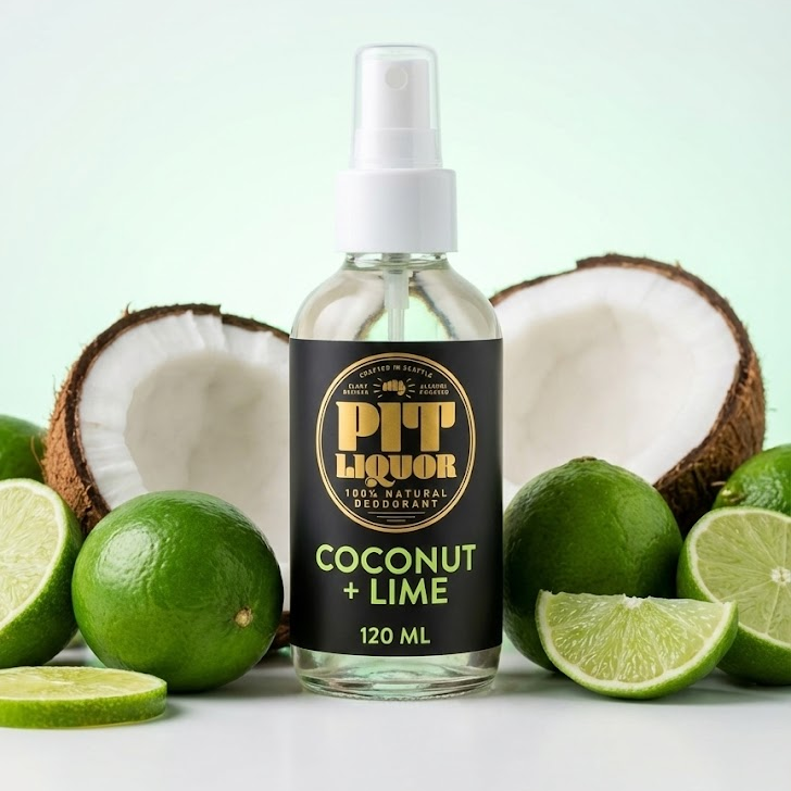 Bottle of coconut and lime flavored liquor with coconuts and limes on a light green background